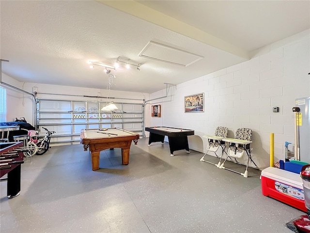 rec room featuring a textured ceiling and pool table