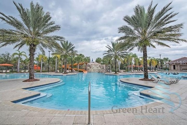 view of swimming pool with a patio