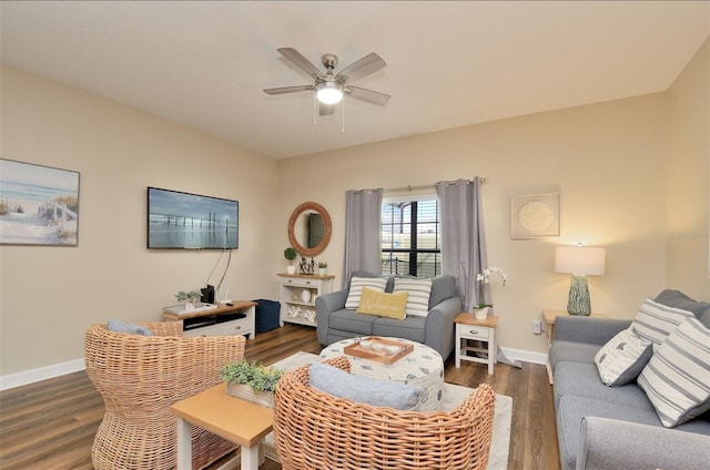 living room with ceiling fan and dark hardwood / wood-style flooring