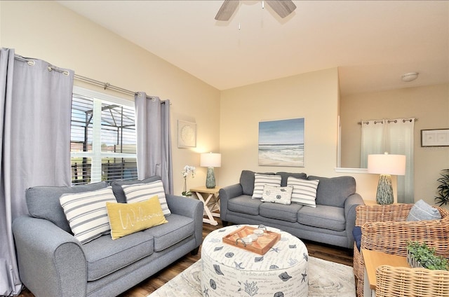 living room featuring ceiling fan and hardwood / wood-style flooring