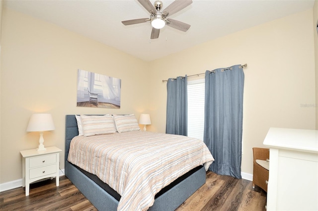 bedroom featuring ceiling fan and dark wood-type flooring