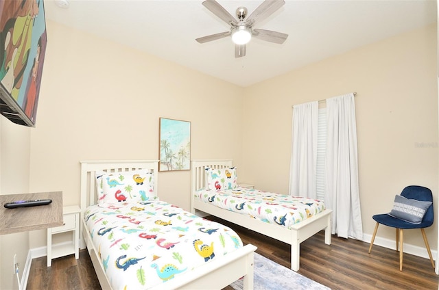 bedroom featuring ceiling fan and dark hardwood / wood-style floors