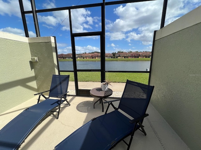 sunroom with a water view