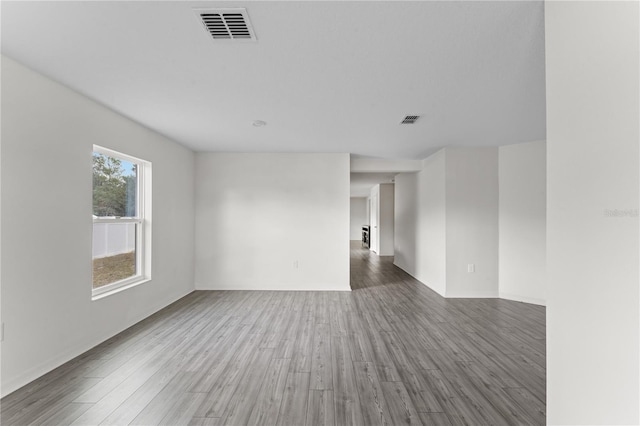 spare room featuring dark wood-type flooring