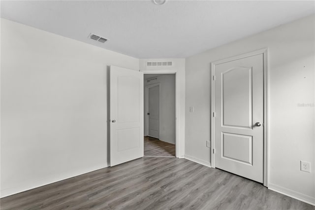 unfurnished bedroom with light hardwood / wood-style flooring