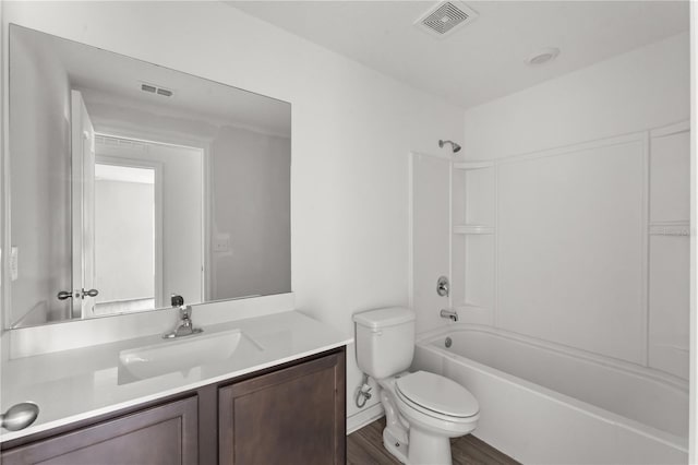 full bathroom featuring vanity, hardwood / wood-style flooring, toilet, and shower / bathtub combination