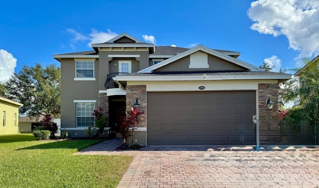 view of front of home featuring a front yard and a garage