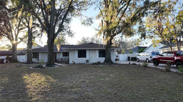 ranch-style home with a front yard