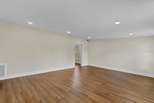 spare room with light hardwood / wood-style floors