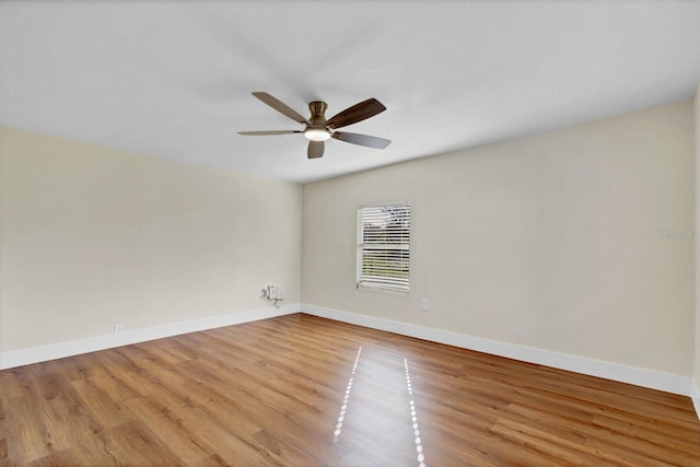 unfurnished room featuring ceiling fan and light wood-type flooring