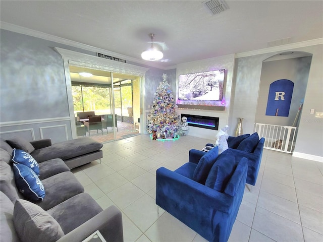 living room featuring crown molding and tile patterned floors