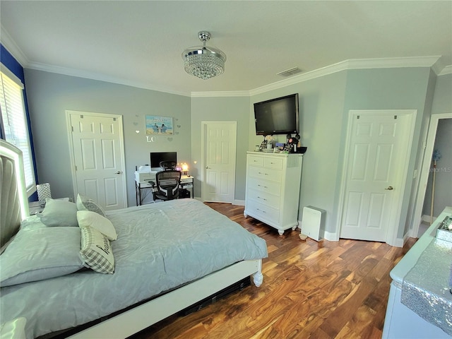 bedroom with dark wood-type flooring and ornamental molding