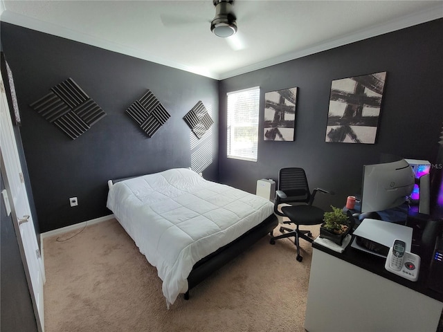 carpeted bedroom featuring ceiling fan and ornamental molding