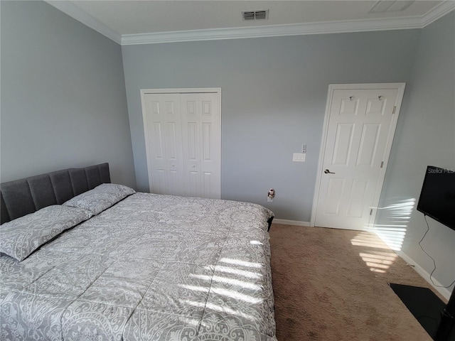 carpeted bedroom featuring a closet and ornamental molding