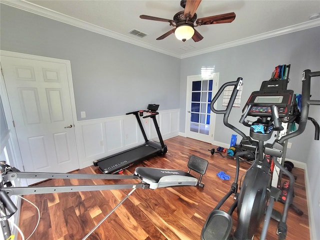 exercise room with ceiling fan, hardwood / wood-style floors, and crown molding