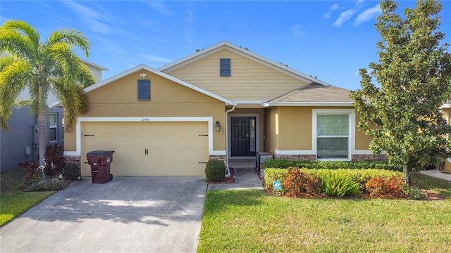 view of front of home with a garage and a front lawn