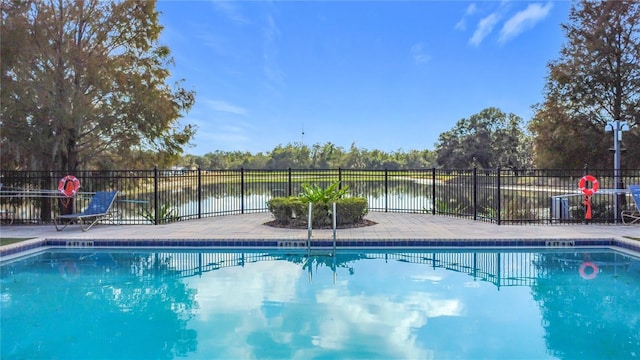 view of pool with a water view