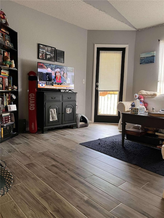 interior space with hardwood / wood-style floors and a textured ceiling