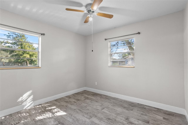 unfurnished room with light hardwood / wood-style floors and ceiling fan