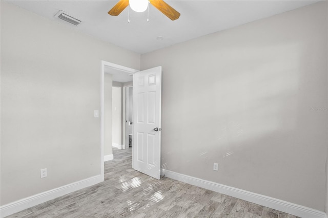 unfurnished room with ceiling fan and light wood-type flooring