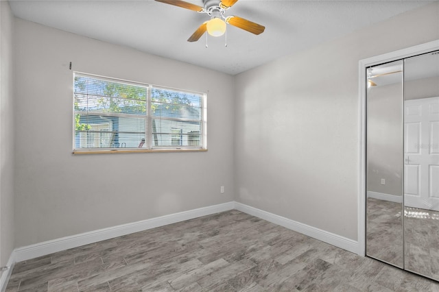 unfurnished room featuring ceiling fan and light hardwood / wood-style flooring