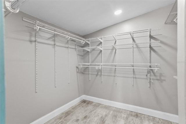 walk in closet featuring hardwood / wood-style floors