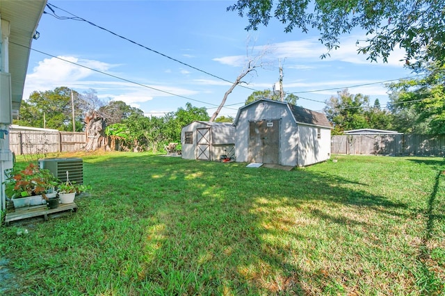 view of yard with cooling unit and a shed