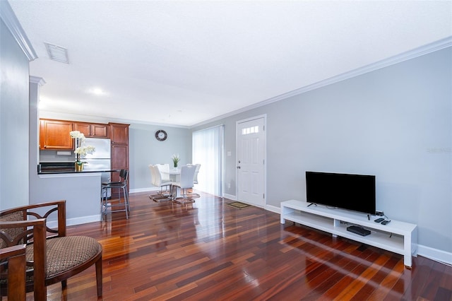 living room featuring crown molding and dark wood-type flooring