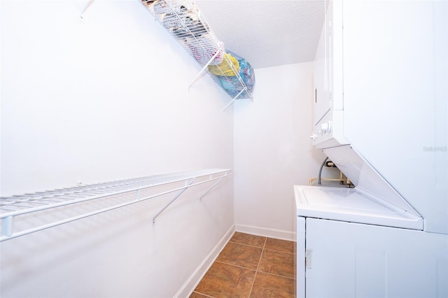 spacious closet with dark tile patterned floors