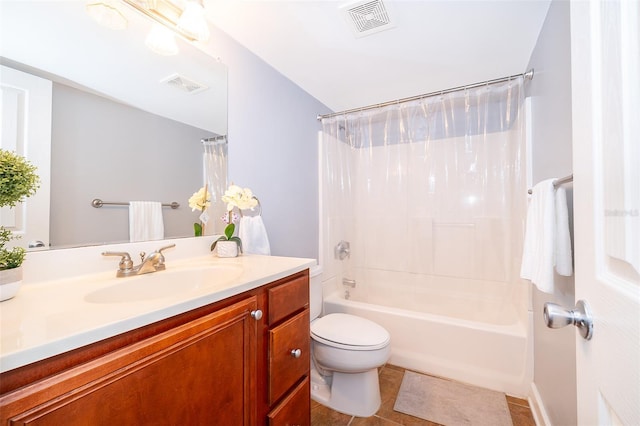 full bathroom featuring toilet, tile patterned floors, vanity, and shower / tub combo with curtain