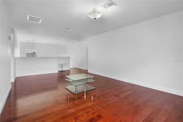 spare room featuring dark hardwood / wood-style floors