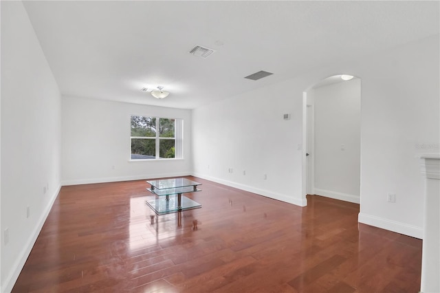 empty room with dark wood-type flooring