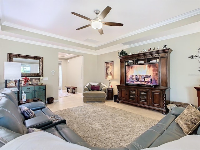 living room featuring ceiling fan and ornamental molding