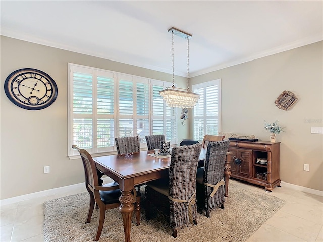 tiled dining room with a chandelier, crown molding, and a healthy amount of sunlight