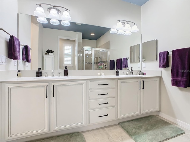 bathroom with tile patterned floors, vanity, and walk in shower