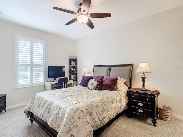 bedroom with light colored carpet and ceiling fan