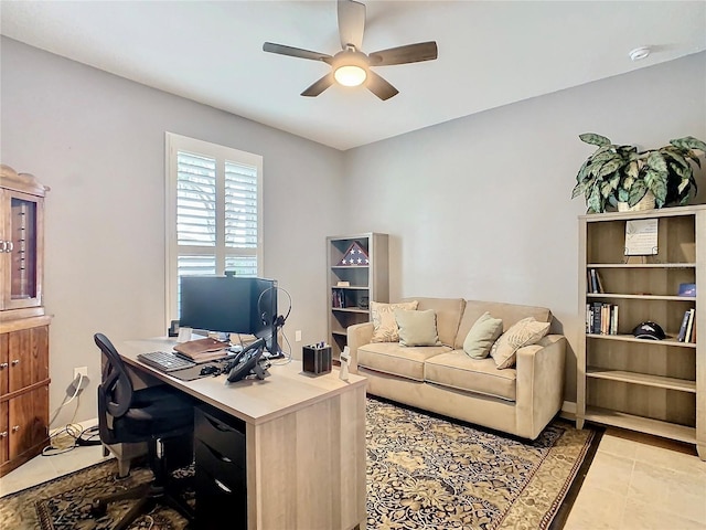 office area with ceiling fan and light tile patterned floors