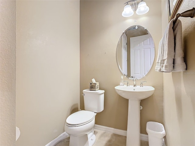 bathroom with tile patterned floors and toilet