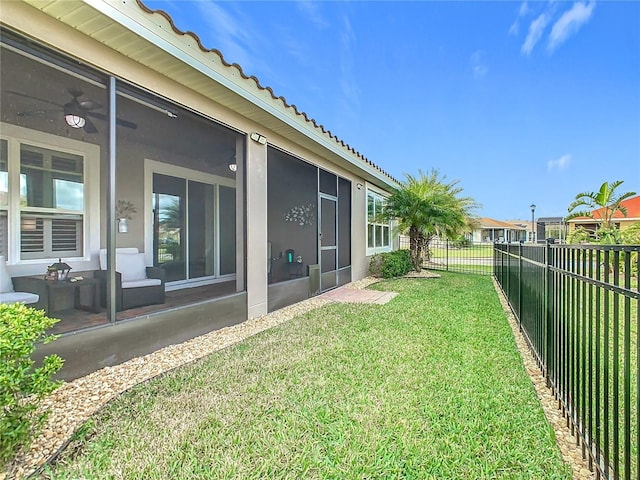 view of yard with a sunroom