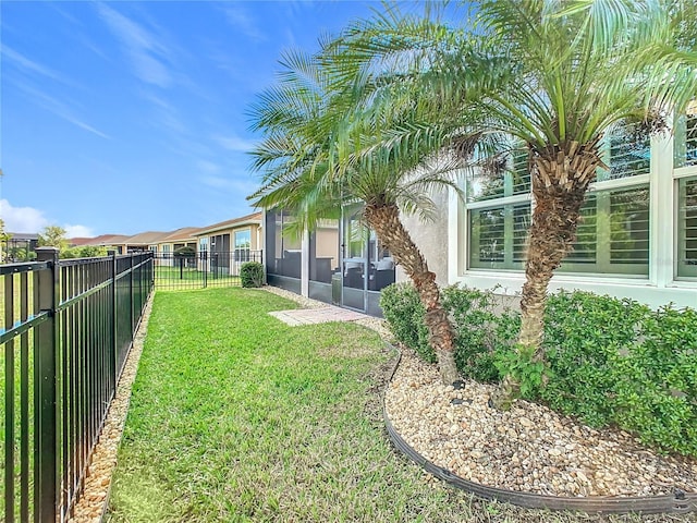 view of yard with a sunroom