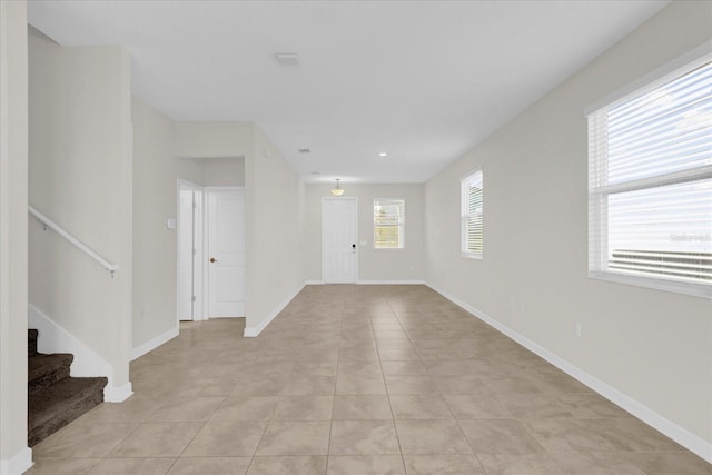 empty room featuring light tile patterned floors