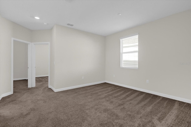 spare room featuring carpet flooring