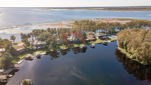 birds eye view of property featuring a water view