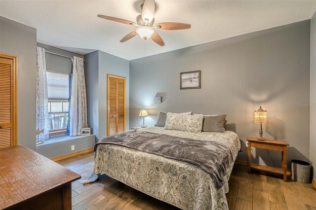 bedroom featuring ceiling fan, a closet, a textured ceiling, and hardwood / wood-style flooring