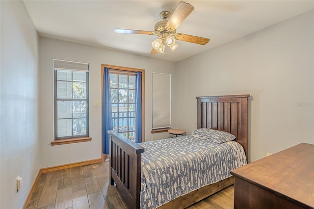 bedroom with ceiling fan and hardwood / wood-style flooring