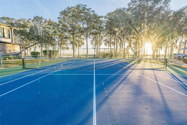 view of sport court with basketball hoop