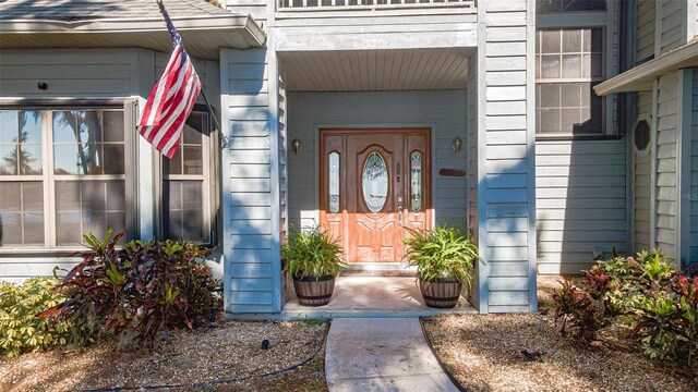 entrance to property featuring a balcony