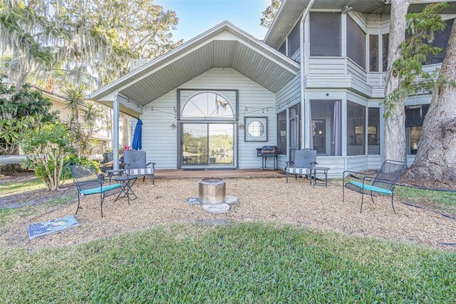 back of property featuring a sunroom