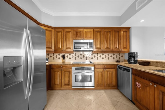 kitchen featuring tasteful backsplash, light stone counters, crown molding, light tile patterned flooring, and appliances with stainless steel finishes