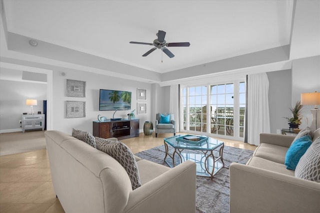 living room with ceiling fan and light tile patterned flooring